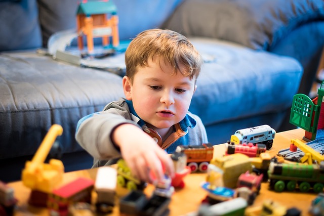 toddler playing colorful wooden blocks